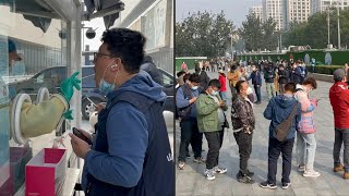 Beijing residents queue for tests as China battles new Covid outbreak | AFP