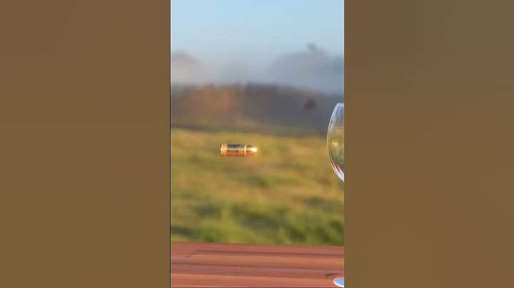 Extreme slow motion of a bullet through this thing