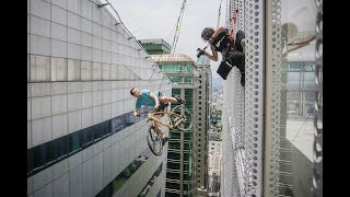 Stunt photoshoot off skyscraper with everyday atheletes