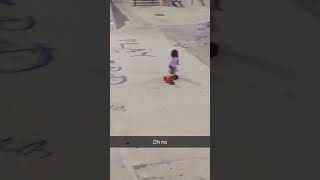 Girl on tricycle drops into ramp at skatepark