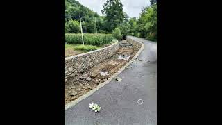 Revised photos of water-damaged road construction PS