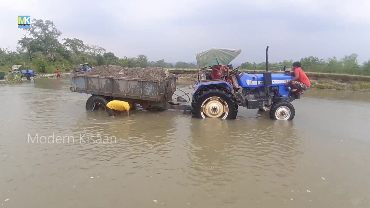 sonalika tractor stuck river side with full loaded trolley