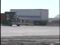 Dump truck hitting barricade