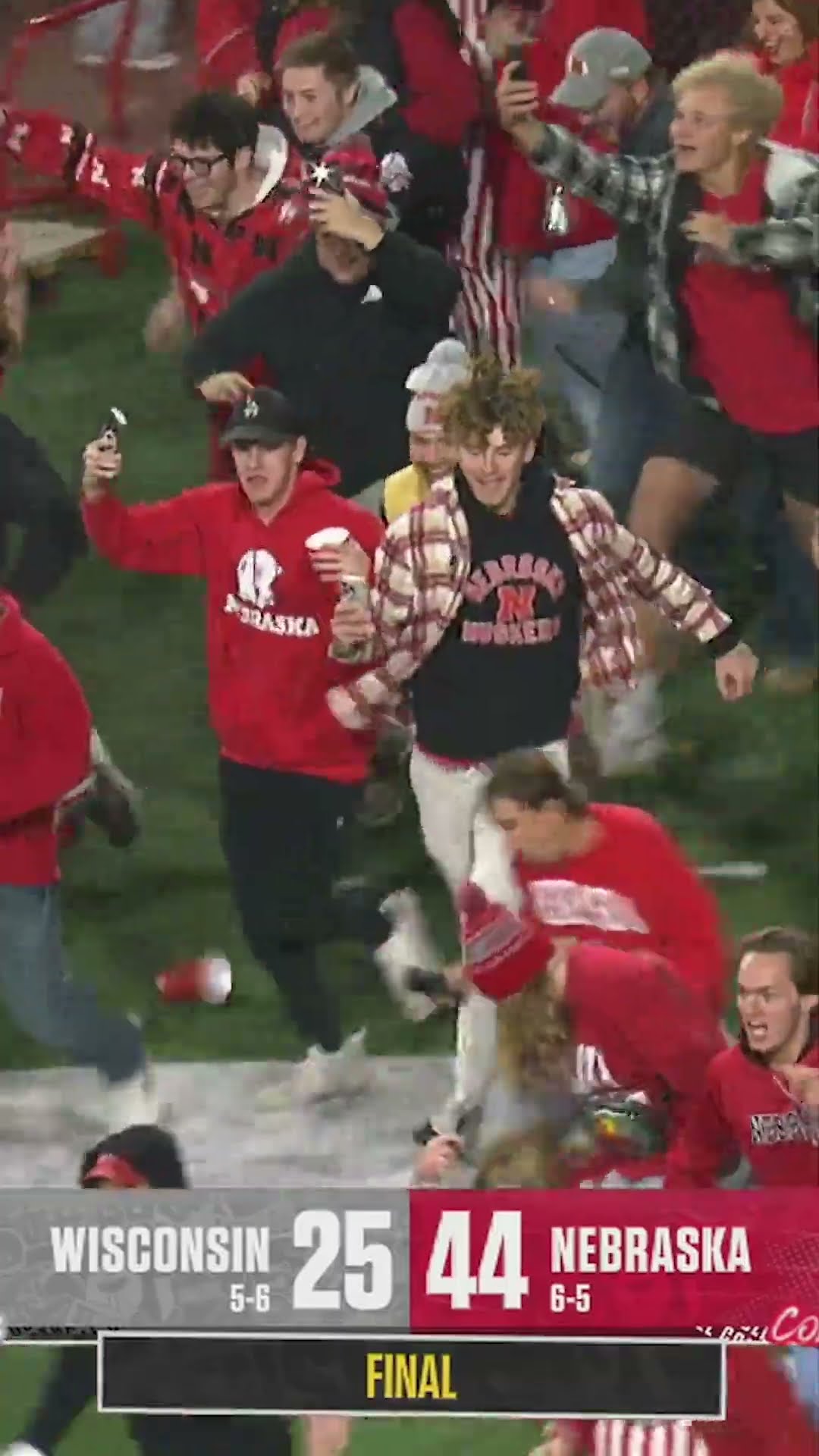 Fan falls, fan hurdles ? #cfb #football #nebraska #wisconsin