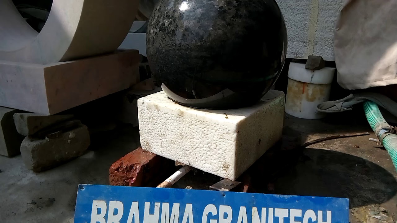 Designer water fountain with rotating globe