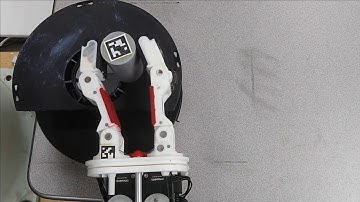Learning to Transfer Dynamic Models of Underactuated Soft Robotic Hands