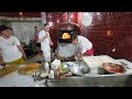 Avpn instructor prepares a pizza during the olimpiadi della vera pizza napoletana 2022 in naples