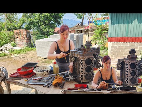 The genius girl repairs and restores an old broken machine.