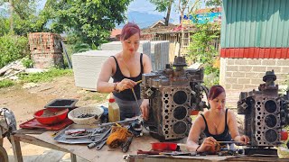 The genius girl repairs and restores an old broken machine.