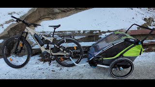 Thule Chariot Cab 2 with electric bicycle on a frozen lake in Sweden