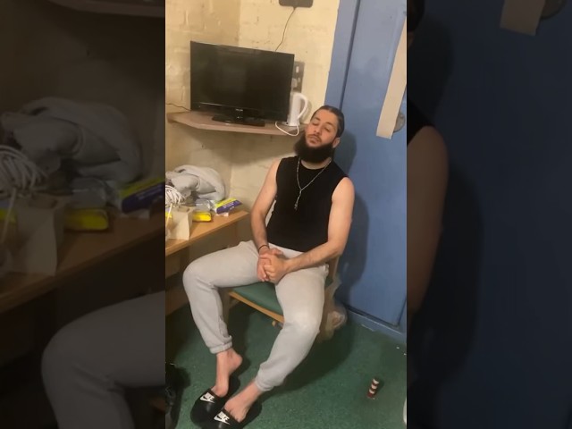 Akhi Ayman shows off his prison cell class=