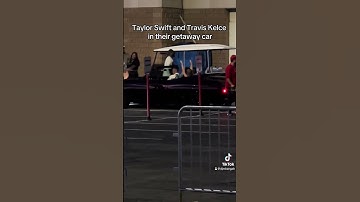 Taylor Swift and Travis Kelce in their getaway car