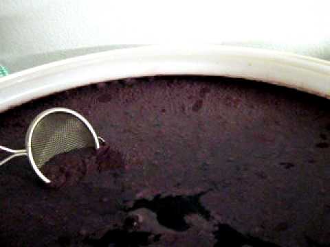 Cleaning Scummy Stuff Off Surface of Wine in Flex Tank