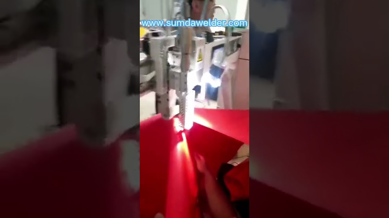 Hot air welding machine for inflatable curved seam welding