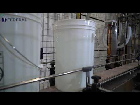 Inline Net Weight Filler and Lidder for Large Containers | Federal Mfg thumbnail image