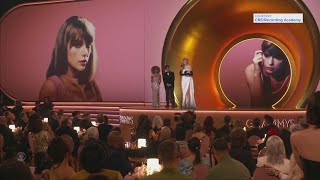 Taylor Swift wins album of the year at the Grammy Awards for the fourth time, setting a new record