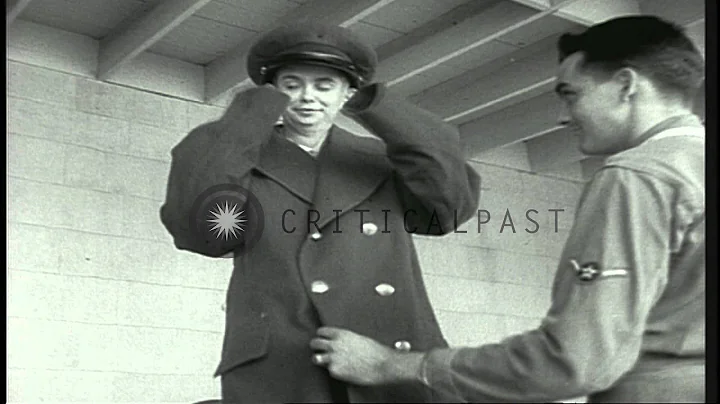 A man tries to fit an air force uniform on Richard...