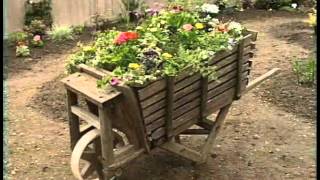 Container planning is taken to the next level with this wooden wheelbarrow that Myrna, Ed