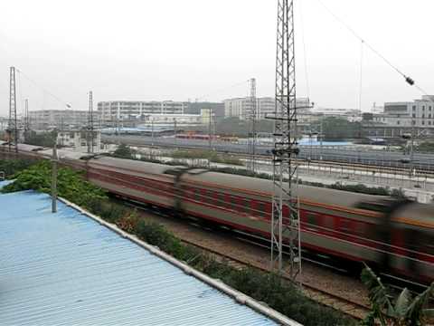 The Southbound single head Chinese railway passenger train no. K304/301 (LianYunGangDong (LianYunGang East) to GuangZhou) haul by SS8 0141 + 25B and 25G pass near the GuangZhouBei (GuangZhou North) Station with great horn. Time: 04:13 pm Date: 03/02/2010 Canon G9 30 fps 640x480 standard Place: Near the GuangZhouBei (GuangZhou North) Station