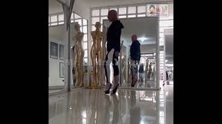 Godfather of supermodels, slow motion demonstration of catwalk foot movements.