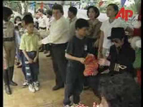 Michael Jackson hands out gifts to 300 orphans at an annual Christmas party in Manila