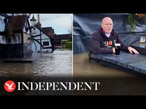 Pub owner drinks pint in waist-deep water during Storm Henk floods