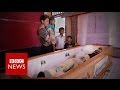 Living with the dead in indonesia  bbc news