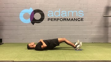 Eccentric hamstring bridges with Sliders