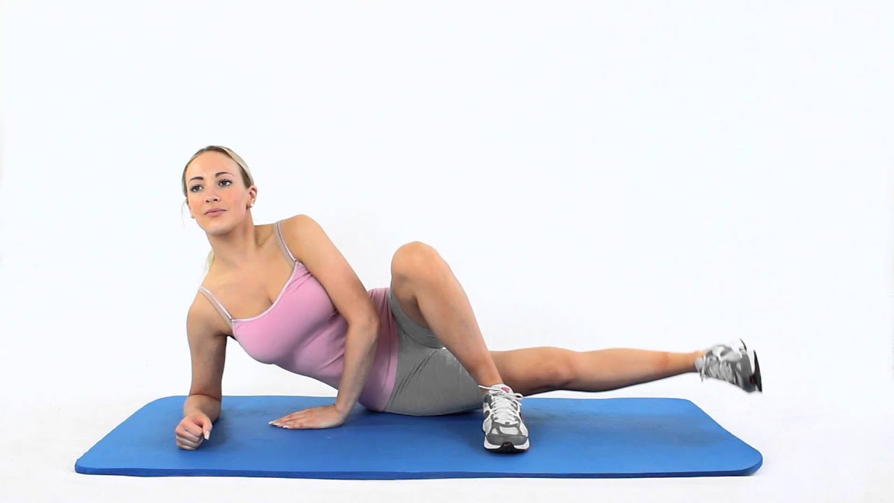 Woman doing Lying side leg lifts or lateral raises hip abductors