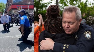 video: 'These cops love you': US police officers join George Floyd protests against police brutality