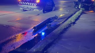 Debris on River Drive after car flips in Davenport