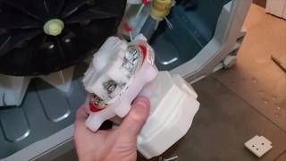 Replacing the drain pump on a Fisher Paykal model WL4227P1 washing machine.