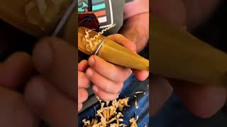 Wood curls whisper—precision breathes through steady carving rhythm