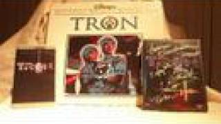 I LOVE me some TRON
As I remember it...
1982 @ the EL REY Theatre located on Wilshire BLVD in Los Angeles. The movie TRON was playing there and my folks took me to see this pioneering film. I was about 5 years old and I clearly remember seeing pictures of the film in an issue of 3,2,1 Contact. In the pictures I saw people glowing with different color lights and grids all over the place. I couldnt comprehend what it all meant but I handed the magazine over to my mother and asked her to look at it. She thought it looked pretty XD She also noticed it was a new Disney film and read the rest of the article. The film was coming out in couple of weeks. She said wed go if I behaved in kindergarden - lol
That day came and my mother and father took me to see it. This scene always stuck with me. There was NOTHING like it ive ever seen! 20+ years would go by and im still amazed by the work put into this film.
On June 17, 2007, I had the opportunity to catch TRON in its 70mm glory complete with a Q&A session with some of the cast and crew members! So I brought my 20th Anniversary TRON DVD along and had the crew sign it :) This movie meant so much to me over the years I even bought the coin-op ! Well as you can see in the clip it pretty much needs work. I have some friends of mine who are heavenly into coin-ops and restoration. Im looking forward to having them bring it back to 1982 - but not without a fee. Its all worth it :)
Signatures on the DVD:
-Bruce Boxleitner - TRON
-Dan Shor - RAM
-Steven Lisberger - Director
-Harrison Ellenshaw & Richard Taylor - Visual Effects Supervisor
-Bill Kroyer - Production Storyboards
-Syd Mead - Electronic world conceptual artist I LOVE me some TRON