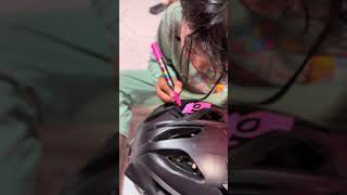 drawing on a TLD Stage helmet with a Posca Marker