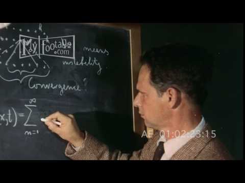 1950s Engineer Writes Scientific Equations on Blackboard