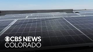 Crews install solar panels on roof of Montbello High School