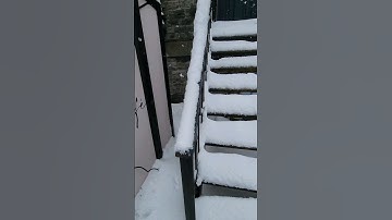Removing Snow From Staircase Handrail