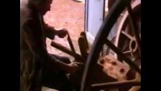 A traditional wood-worker making a cart wheel