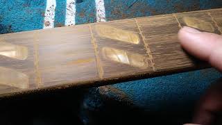How to fill the gaps between old inlays on a guitar fretboard