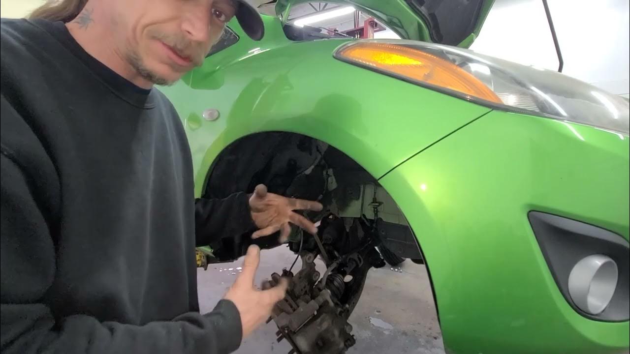 Front Struts on a 2012 Mazda 2 - YouTube