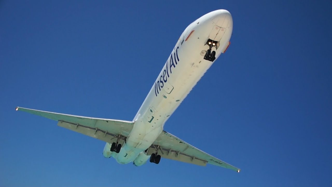 st-maarten-airport-landing-and-take-off-very-close-sunset-maho-beach