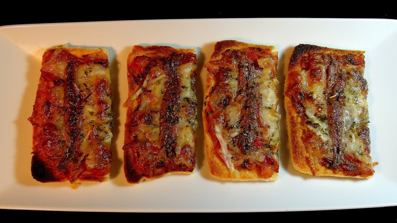 Tostada de tomate anchoa y oregano