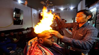 Would you risk your head like that? Fire haircut in Pakistan.