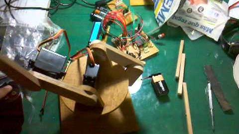 Robotic Arm Made out of wood Servomotors, with a PS2 controller and a pic16f877a (50%)