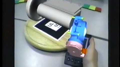 Interaction in a Collaborative Augmented Reality Environment