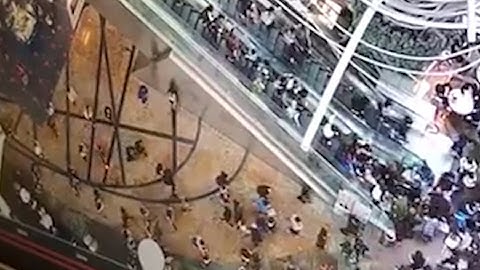 Hong Kong shoppers injured when escalator goes into reverse – video