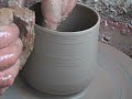 Pottery throwing tea bowls with added slip