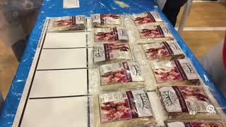 Hundreds of volunteers pack food for Haitians