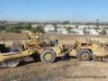 CAT D9R ripping up the earth while 657B's push/pull